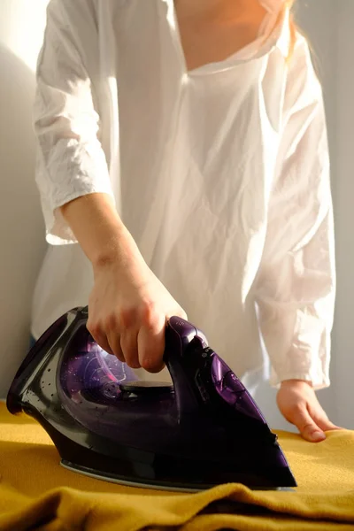 Girl Ironing Clothes Home Yellow Jacket — Stock Photo, Image