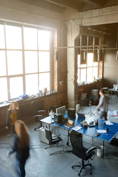 Work in a modern office. Movement of people in the frame