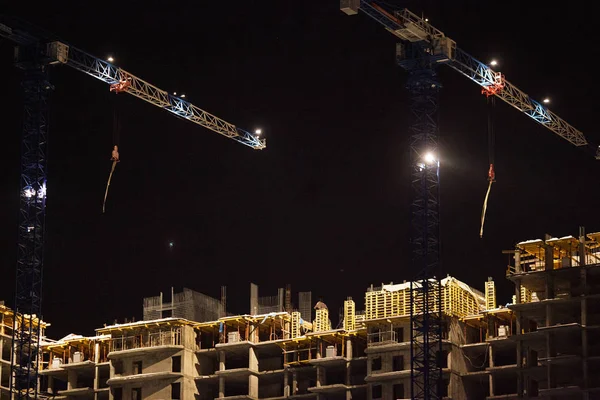 Urban construction of residential buildings in the night metropolis