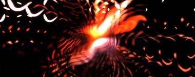 Işık parçacık izleri. Parlayan parçacıkları ve çizgileri olan ışık patlaması yıldızı. Güzel hareketli soyut ışın arkaplanı.