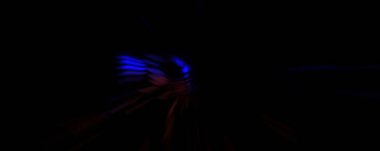 Işık parçacık izleri. Parlayan parçacıkları ve çizgileri olan ışık patlaması yıldızı. Güzel hareketli soyut ışın arkaplanı.