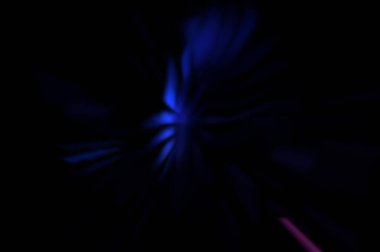 Işık parçacık izleri. Parlayan parçacıkları ve çizgileri olan ışık patlaması yıldızı. Güzel hareketli soyut ışın arkaplanı.