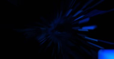 Işık parçacık izleri. Parlayan parçacıkları ve çizgileri olan ışık patlaması yıldızı. Güzel hareketli soyut ışın arkaplanı.