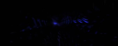 Işık parçacık izleri. Parlayan parçacıkları ve çizgileri olan ışık patlaması yıldızı. Güzel hareketli soyut ışın arkaplanı.