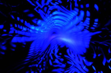 Işık parçacık izleri. Parlayan parçacıkları ve çizgileri olan ışık patlaması yıldızı. Güzel hareketli soyut ışın arkaplanı.