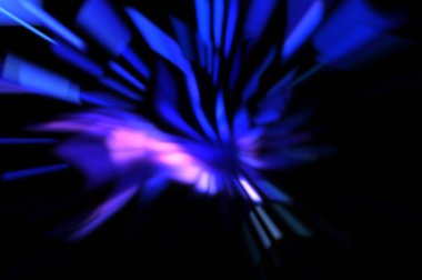 Işık parçacık izleri. Parlayan parçacıkları ve çizgileri olan ışık patlaması yıldızı. Güzel hareketli soyut ışın arkaplanı.