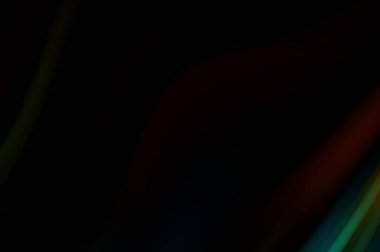 Siyah arka planda renkli düz çizgiler. Sıvı ve sıvı renkli dalgalar karanlıkta akıyor. Duvar kağıdı, afiş, arkaplan, kart, kitap, kapak, poster, afiş, broşür