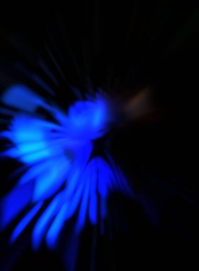 Işık parçacık izleri. Parlayan parçacıkları ve çizgileri olan ışık patlaması yıldızı. Güzel hareketli soyut ışın arkaplanı.