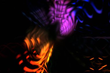 Işık parçacık izleri. Parlayan parçacıkları ve çizgileri olan ışık patlaması yıldızı. Güzel hareketli soyut ışın arkaplanı.