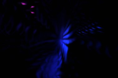 Işık parçacık izleri. Parlayan parçacıkları ve çizgileri olan ışık patlaması yıldızı. Güzel hareketli soyut ışın arkaplanı.