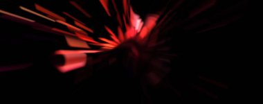 Işık parçacık izleri. Parlayan parçacıkları ve çizgileri olan ışık patlaması yıldızı. Güzel hareketli soyut ışın arkaplanı.