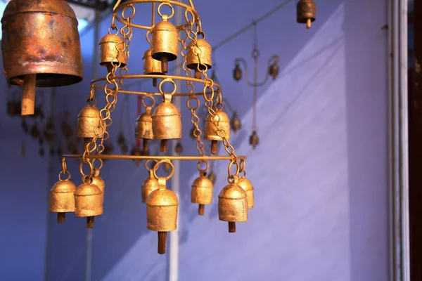 Home decoration items, small bell hanging on wall at White dessert, Dorado, Kutch, Gujarat, India