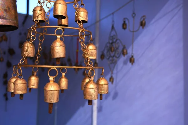 Home decoration items, small bell hanging on wall at White dessert, Dorado, Kutch, Gujarat, India