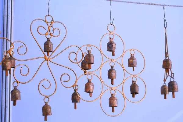 Home decoration items, small bell hanging on wall at White dessert, Dorado, Kutch, Gujarat, India
