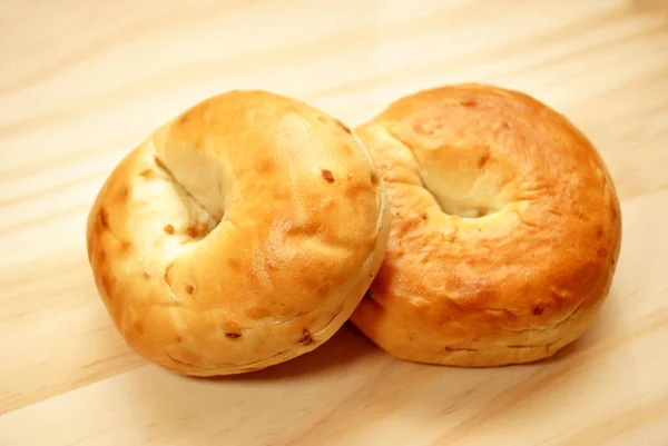 Two Onion Bagels Wooden Cutting Board — Stock Photo, Image