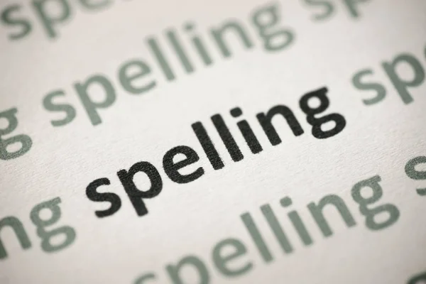 Spelling Van Het Woord Gedrukt Wit Papier Macro — Stockfoto