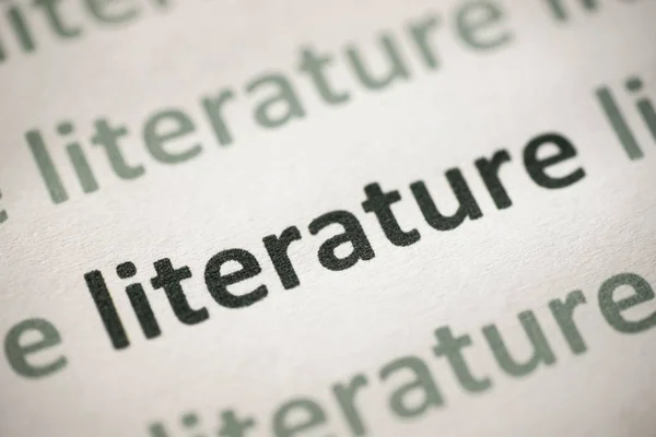 word literature printed on white paper macro