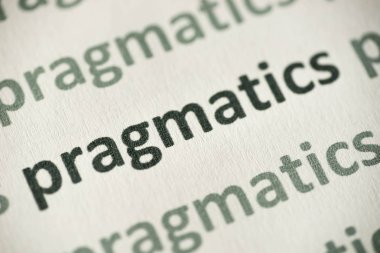 word pragmatics printed on white paper macro clipart