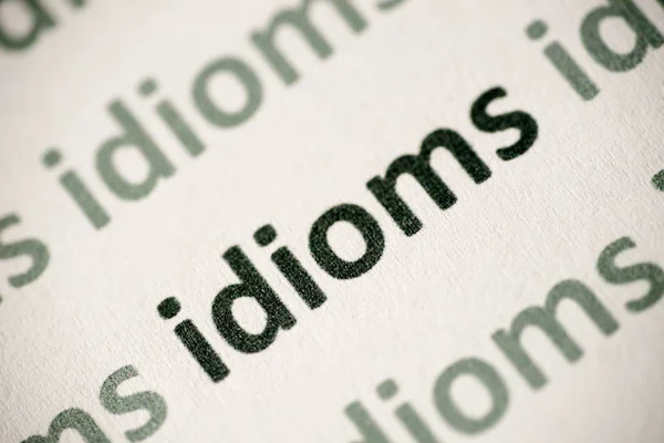 Idiomes Mots Imprimés Sur Papier Blanc Macro — Photo