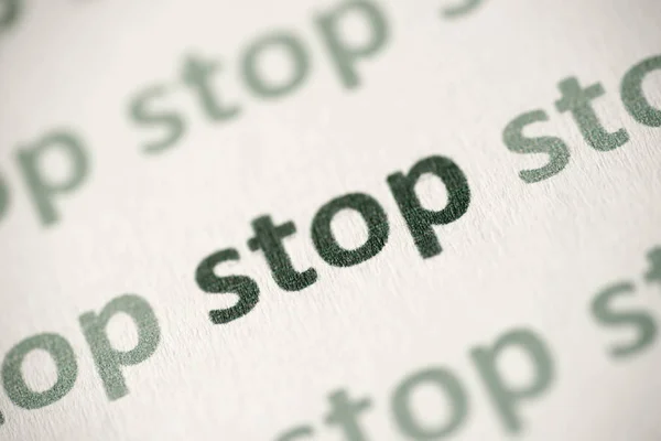 Ordet Stop Tryckt Vitt Papper Makro — Stockfoto