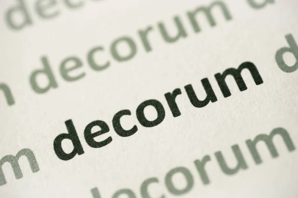 Decorum Słowo Drukowane Białym Papierze Makro — Zdjęcie stockowe
