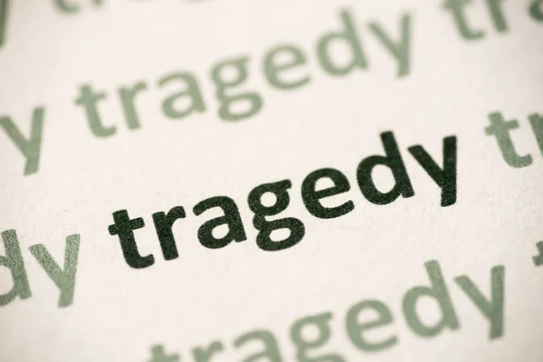 Word Tragedy Printed White Paper Macro — Stock Photo, Image