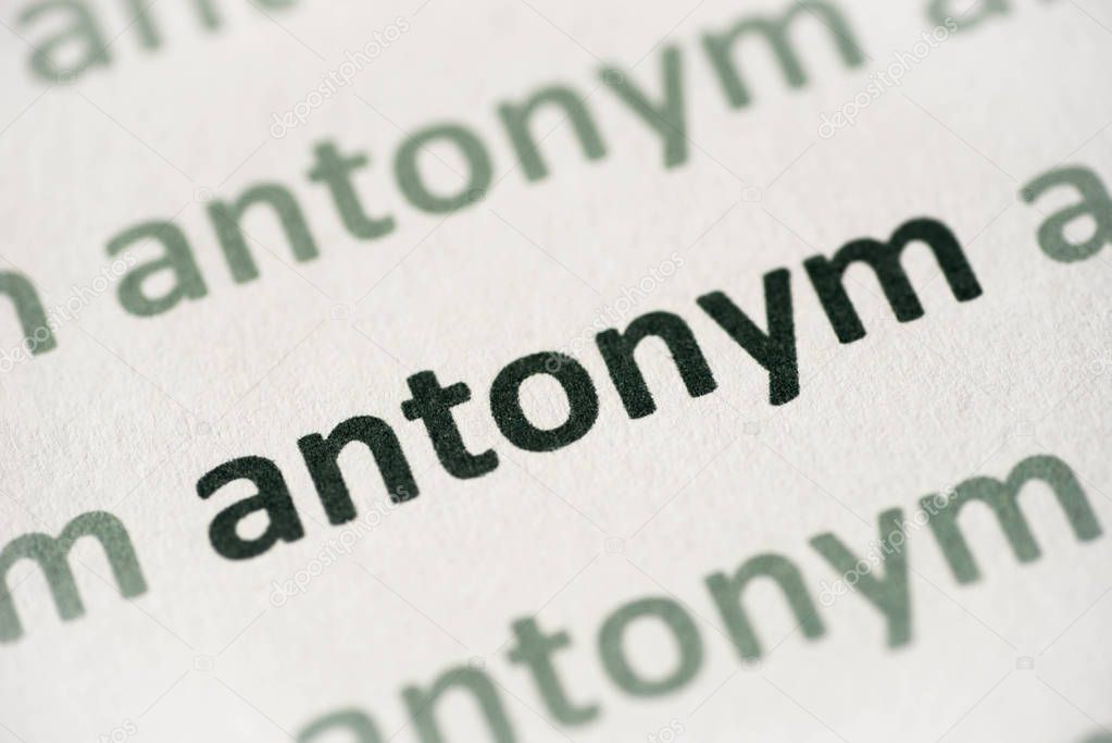 word antonym printed on white paper macro