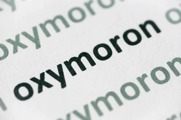 Word Oxymoron Printed White Paper Macro — Stock Photo, Image