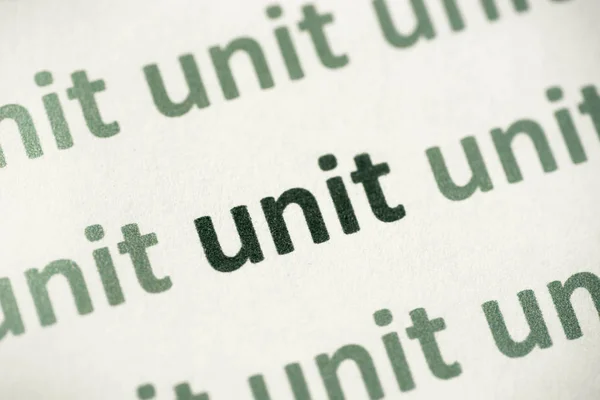 Unité Mot Imprimée Sur Papier Blanc Macro — Photo