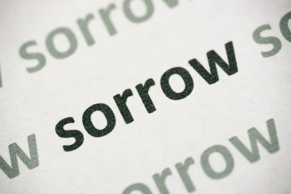 Word Sorrow Printed White Paper Macro — Stock Photo, Image
