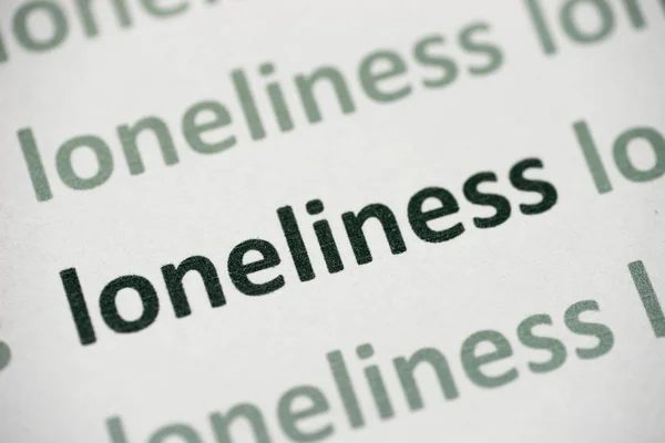 Word Loneliness Printed White Paper Macro — Stock Photo, Image