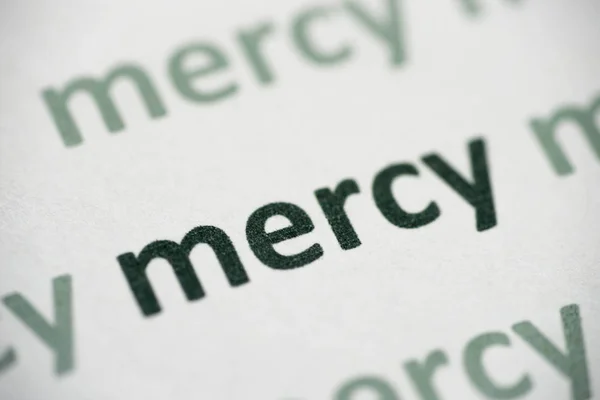Word Mercy Printed White Paper Macro — Stock Photo, Image