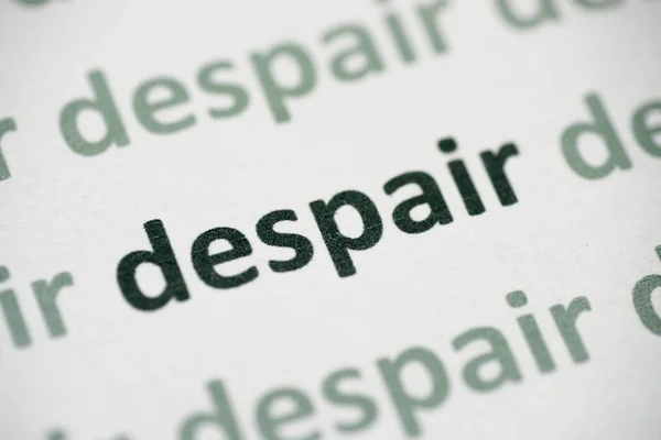 Word Despair Printed White Paper Macro — Stock Photo, Image