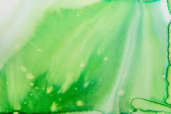 green abstract watercolor painting on paper background texture