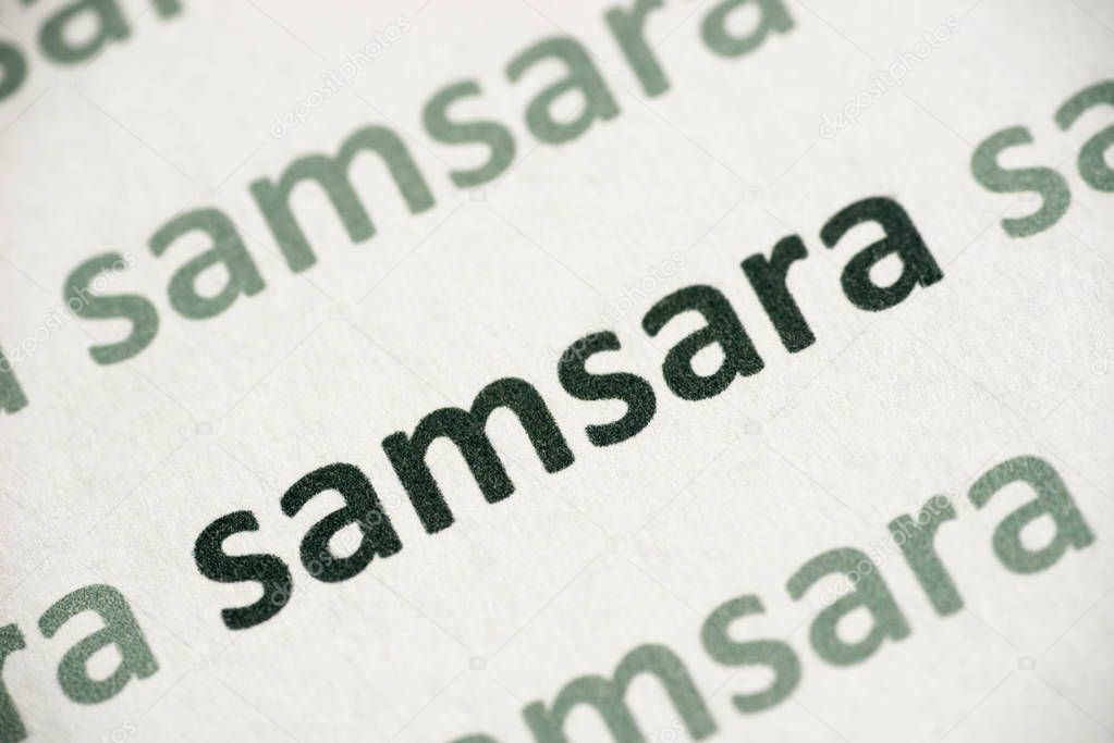word samsara printed on white paper macro