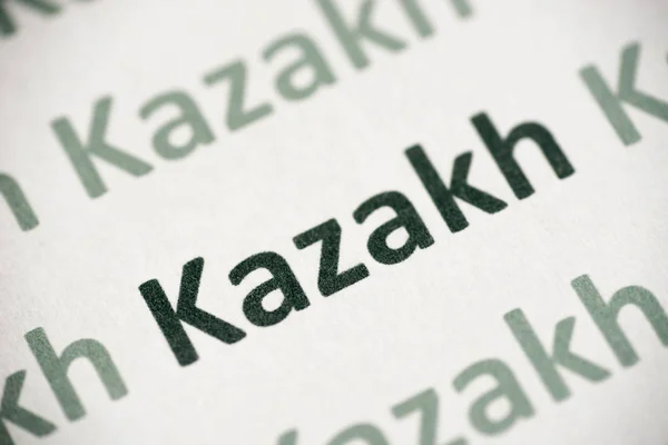 Wyraz Język Kazachski Drukowany Białym Papierze Makro — Zdjęcie stockowe