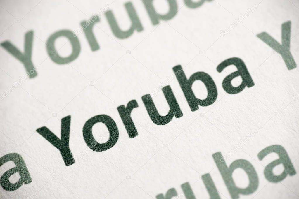 word Yoruba   language printed on white paper macro