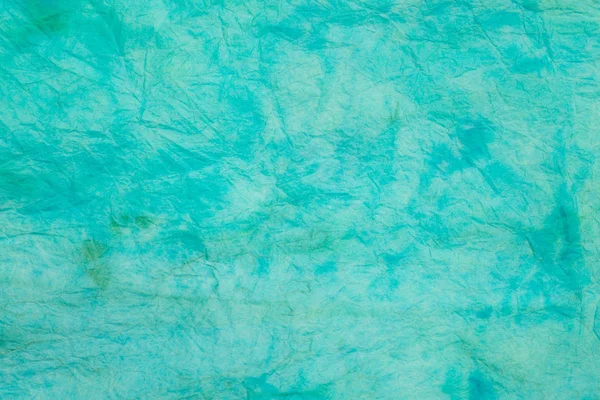 绿松石皱纹彩色纸巾背景纹理宏 — 图库照片