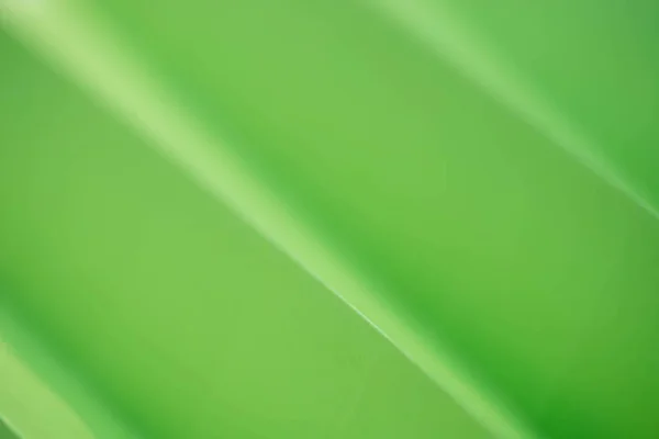 Zöld papírlapot összehajtva háttér — Stock Fotó