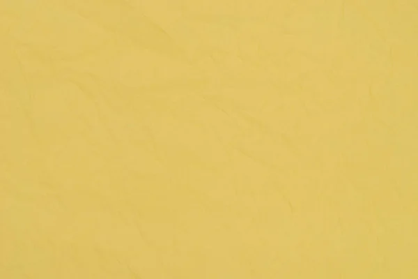 Amarelo vincado tecido papel textura fundo — Fotografia de Stock
