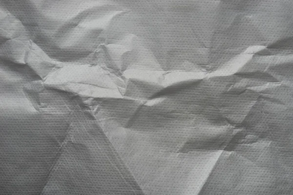 Grey creased wrapping paper background texture — Stock Photo, Image