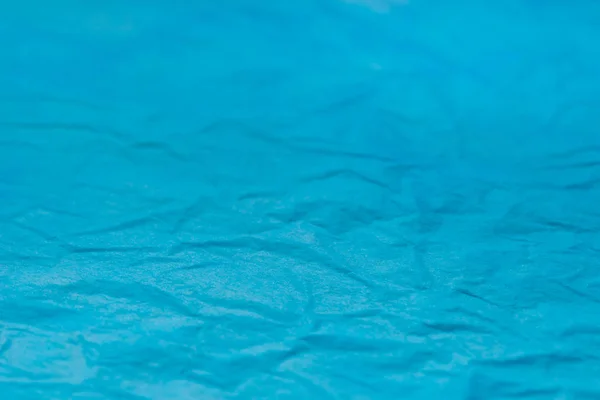 Bleu tissu plissé papette fond texture sélectif focus mac — Photo