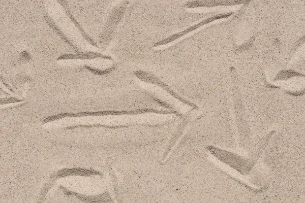 Pilskylt på naturlig sand textur bakgrund — Stockfoto