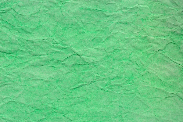 Grön skrynklig pastellpapper bakgrund textur — Stockfoto