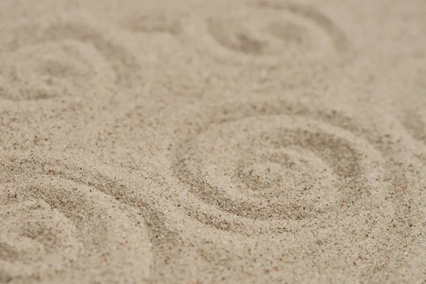 Wellenmuster auf Sand Hintergrund selektiver Fokus — Stockfoto