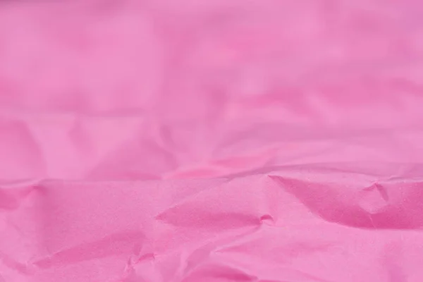 Rosa arrugado color papel textura fondo enfoque selectivo — Foto de Stock