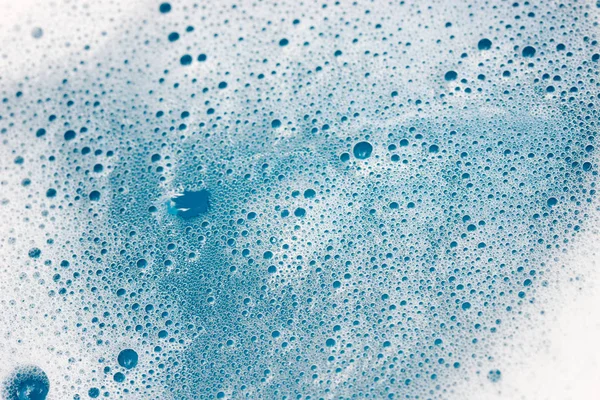 Espuma de jabón y burbujas en el fondo de agua — Foto de Stock