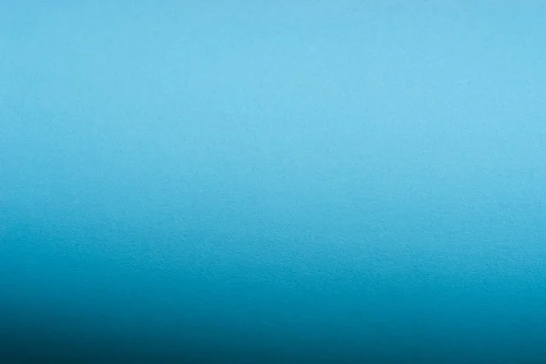 Blå rulle gjord med böjda pappersark bakgrund konsistens — Stockfoto