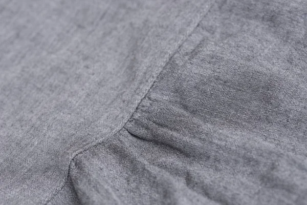 Szary tekstylny tekstura tła — Zdjęcie stockowe