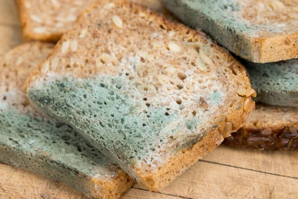 unhealthy food - mold on slices of bread